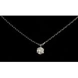 A brilliant cut diamond pendant in a platinum setting