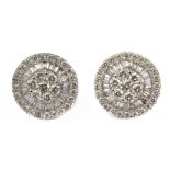 A pair of diamond cluster earrings with an 18 k. white gold setting
