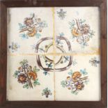 A 19th century wallplaque with four Catalan showing tiles