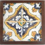 A late 17th century-early 18th century wallplaque with four Catalan showing tiles