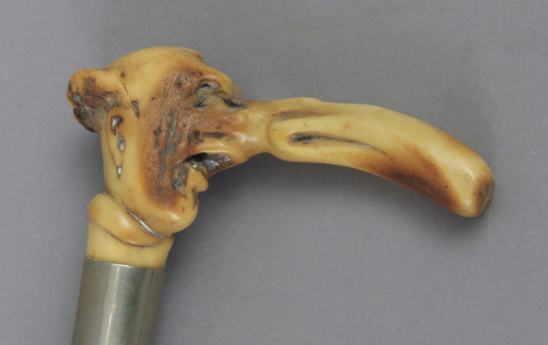 A 19th century fruit wood walking cane with a carved horn handle