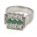 A diamonds and emeralds signet ring with an 18k. white gold setting