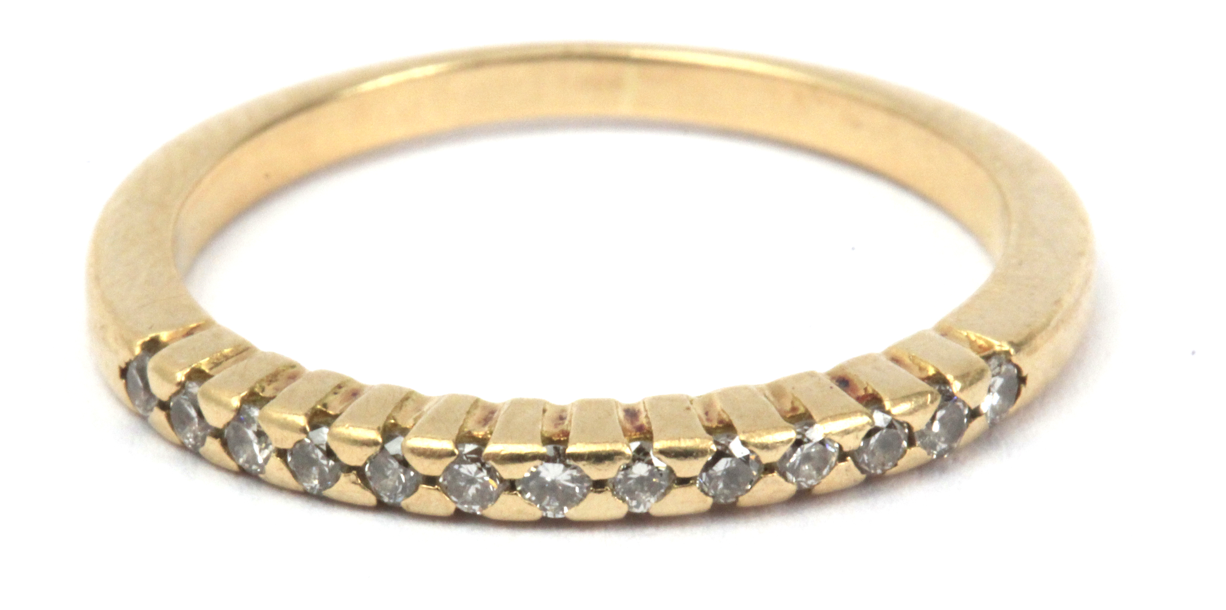 A diamond eternity diamond ring with an 18 k. yellow gold setting