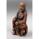 Early 18th century Japanese netsuke in carved wood depicting 'Sennin Tobasaku'