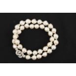 An Akoya cultured pearls necklace with an 18k. white gold clasp