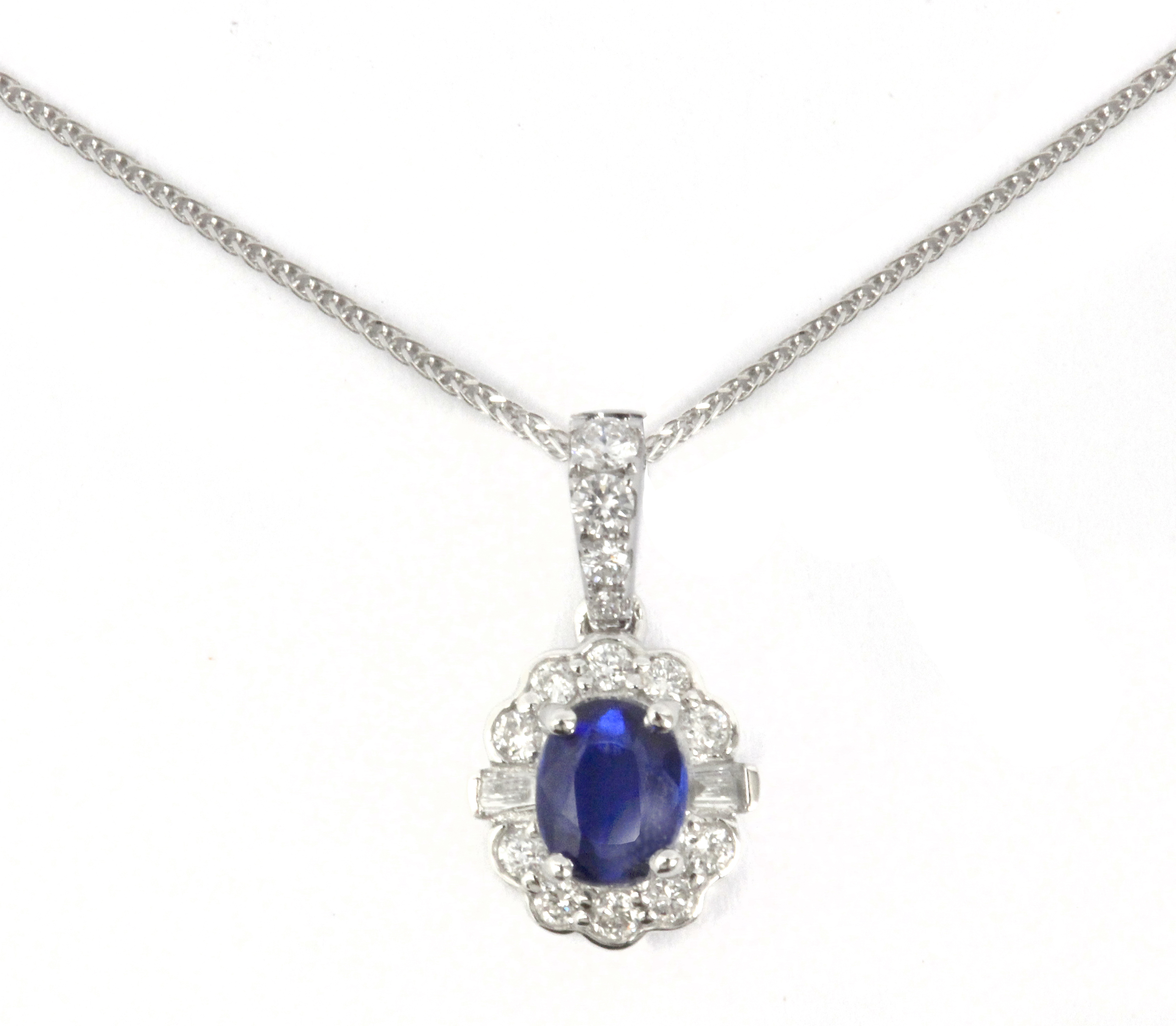 A diamonds and cyanite cluster pendant in an 18 k. white gold setting