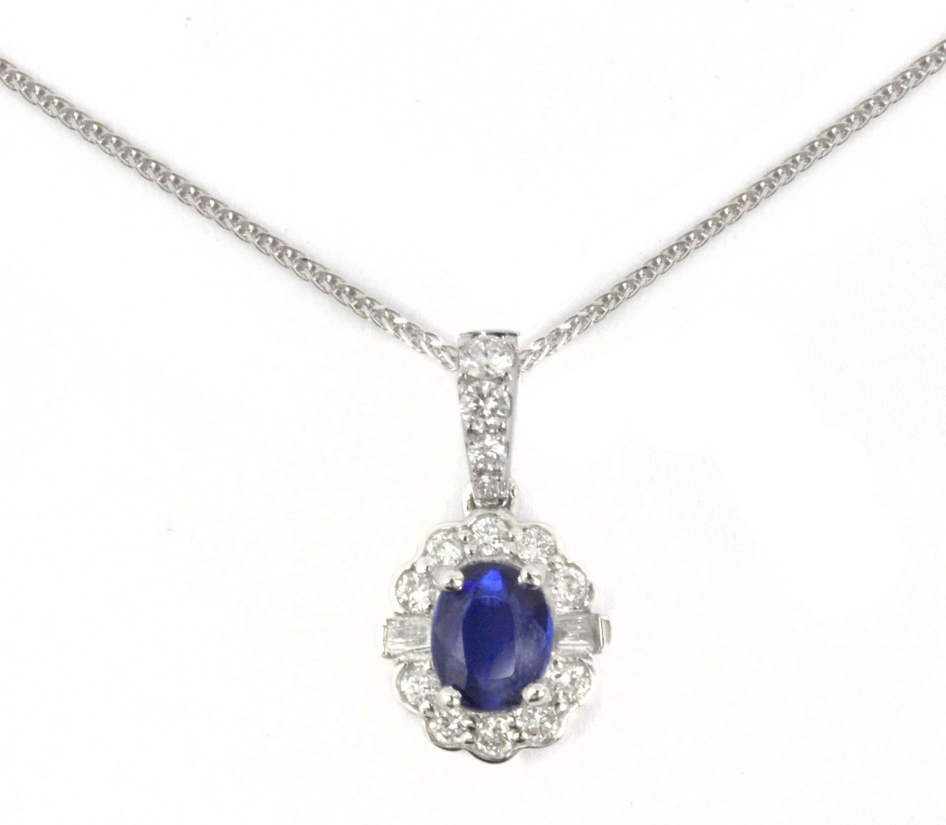 A diamonds and cyanite cluster pendant in an 18 k. white gold setting