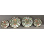 A set of four Canton Famille Rose porcelain plates, late 19th century-early 20th century