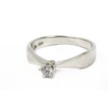 A 0,10 ct. brilliant cut diamond solitaire ring with an 18 k. white gold setting