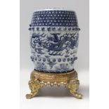 A 20th century Chinese wrist rest in blue and white porcelain with a gilt bronze garniture