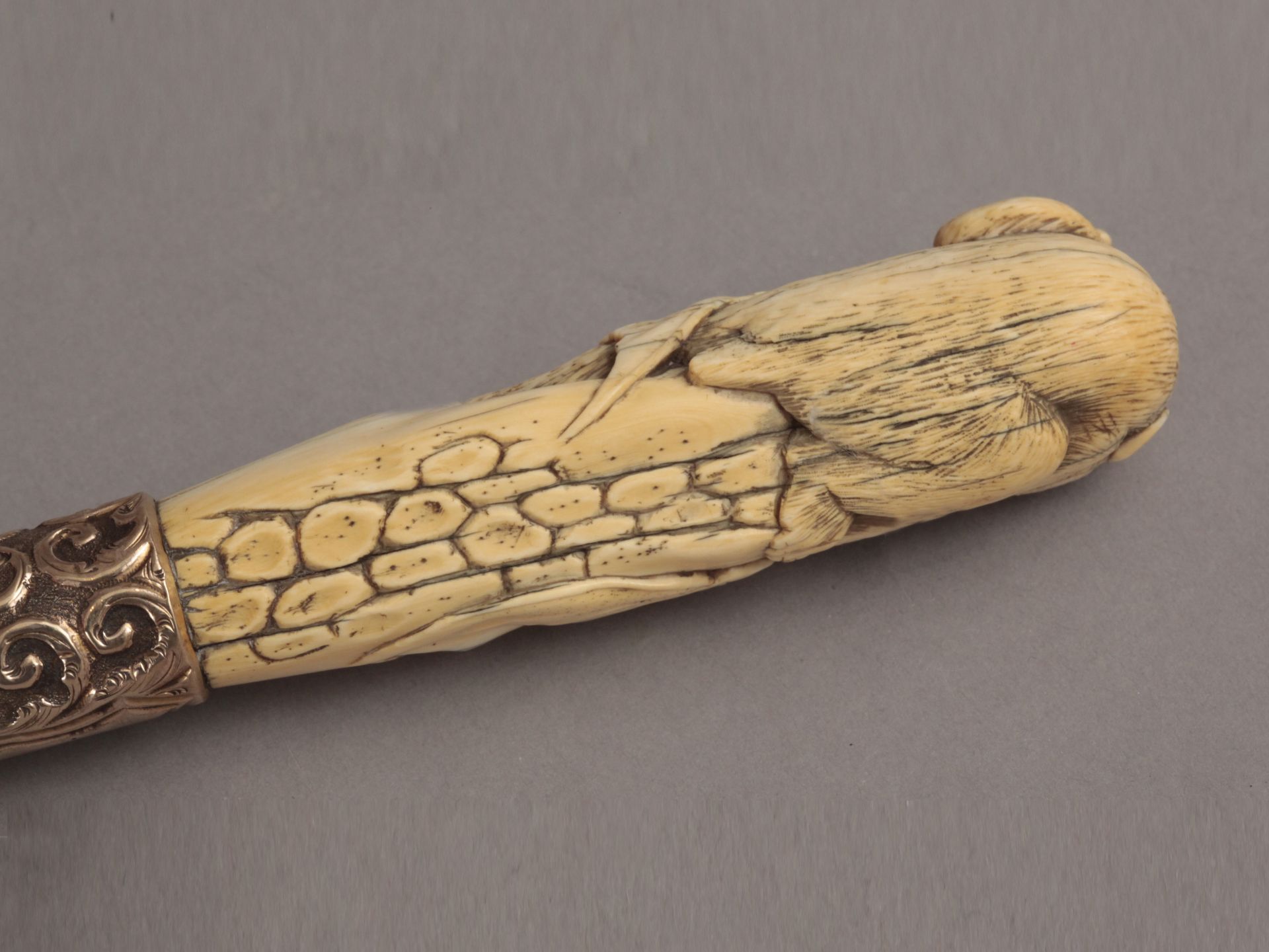A 19th century English ebony an ivory walking cane