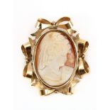 A mid 20th century cameo brooch with an 18k. yellow gold setting