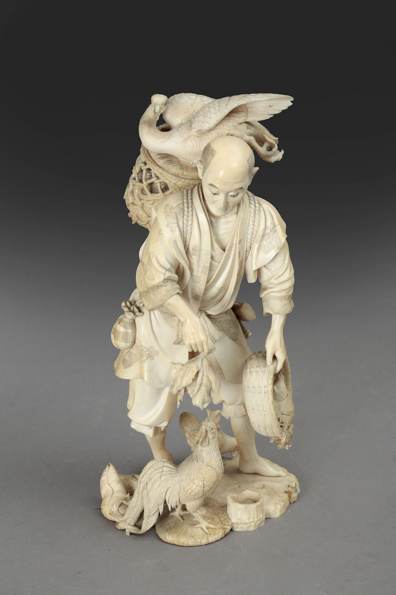 Late 19th century Japanese school. A carved ivory okimono depicting a farmer feeding birds. Signed - Bild 2 aus 8