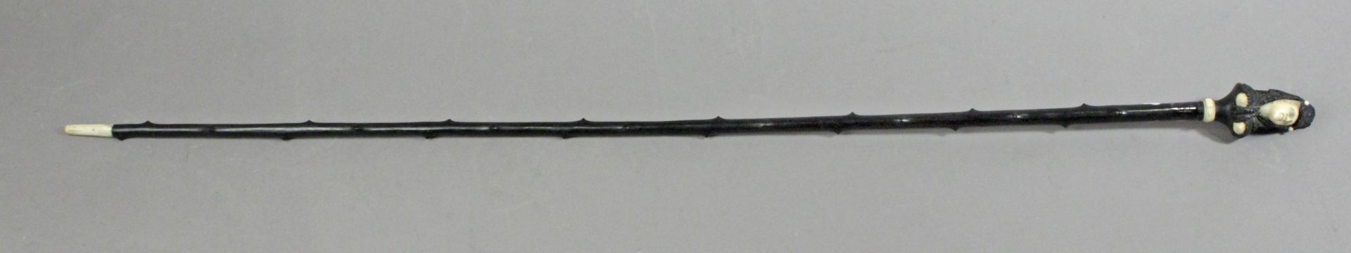 A 19th century ebony and ivory walking cane, possible Spanish