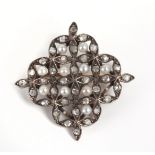 An early 20th century brooch in gold, platinum and pearls