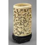 19th century Chinese school. A carved ivory Canton style brush holder