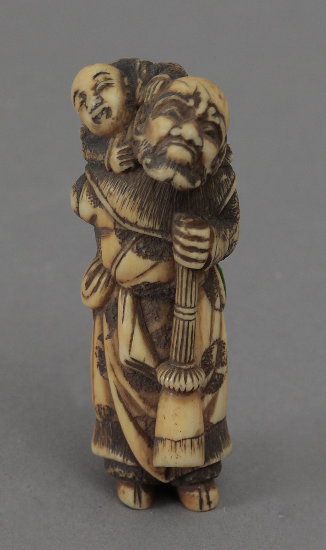 18th century Japanese school. A carved ivory okimono