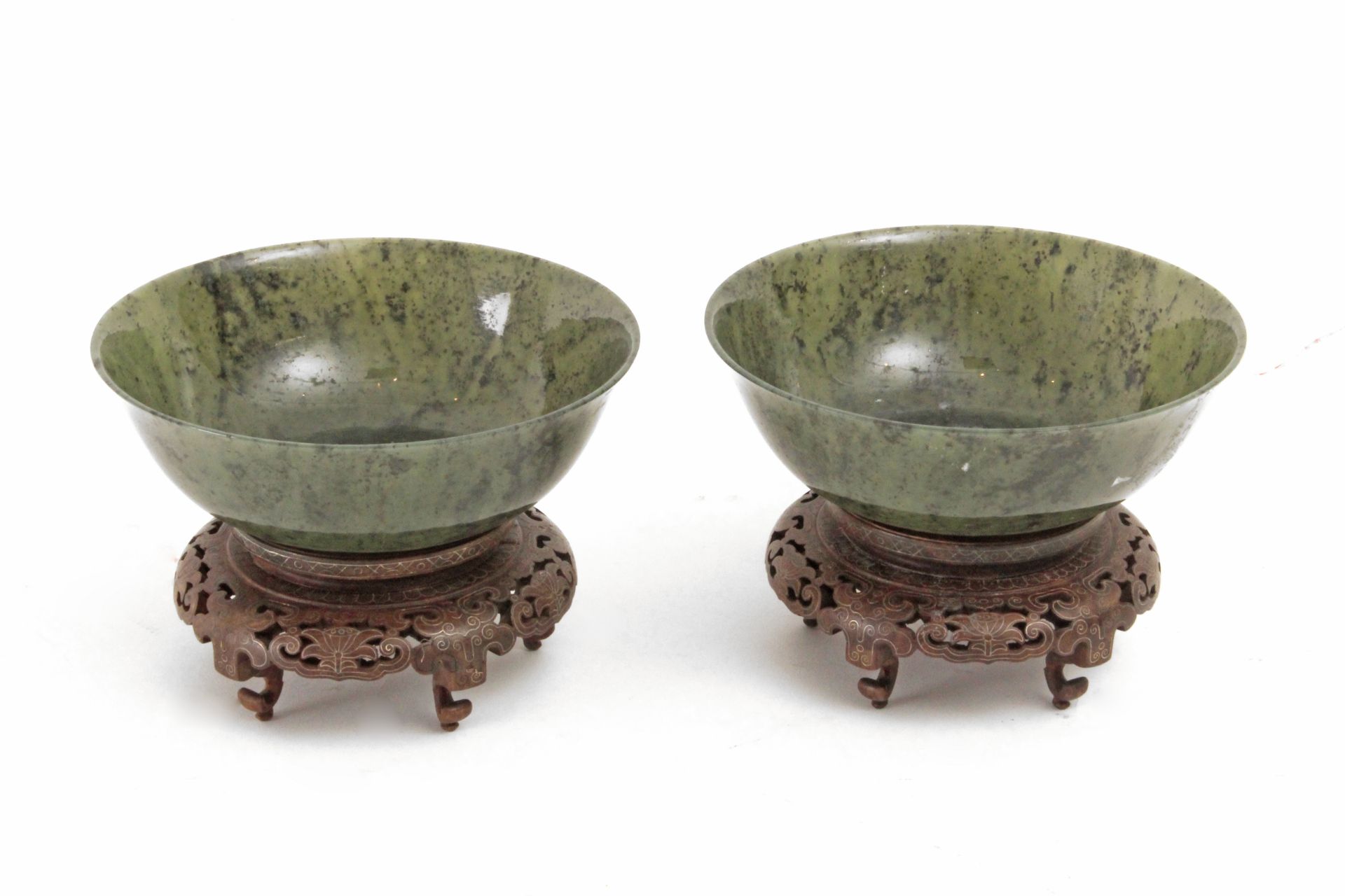 A pair of last third of 19th century-early20th century Chinese bowls in carved nephrite