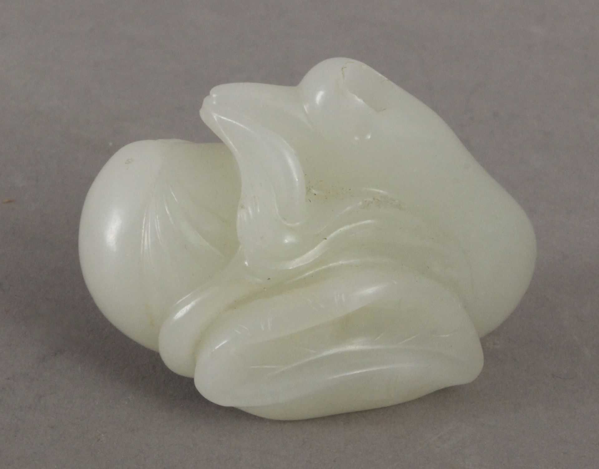 An 18th century Chinese pendant in carved jade