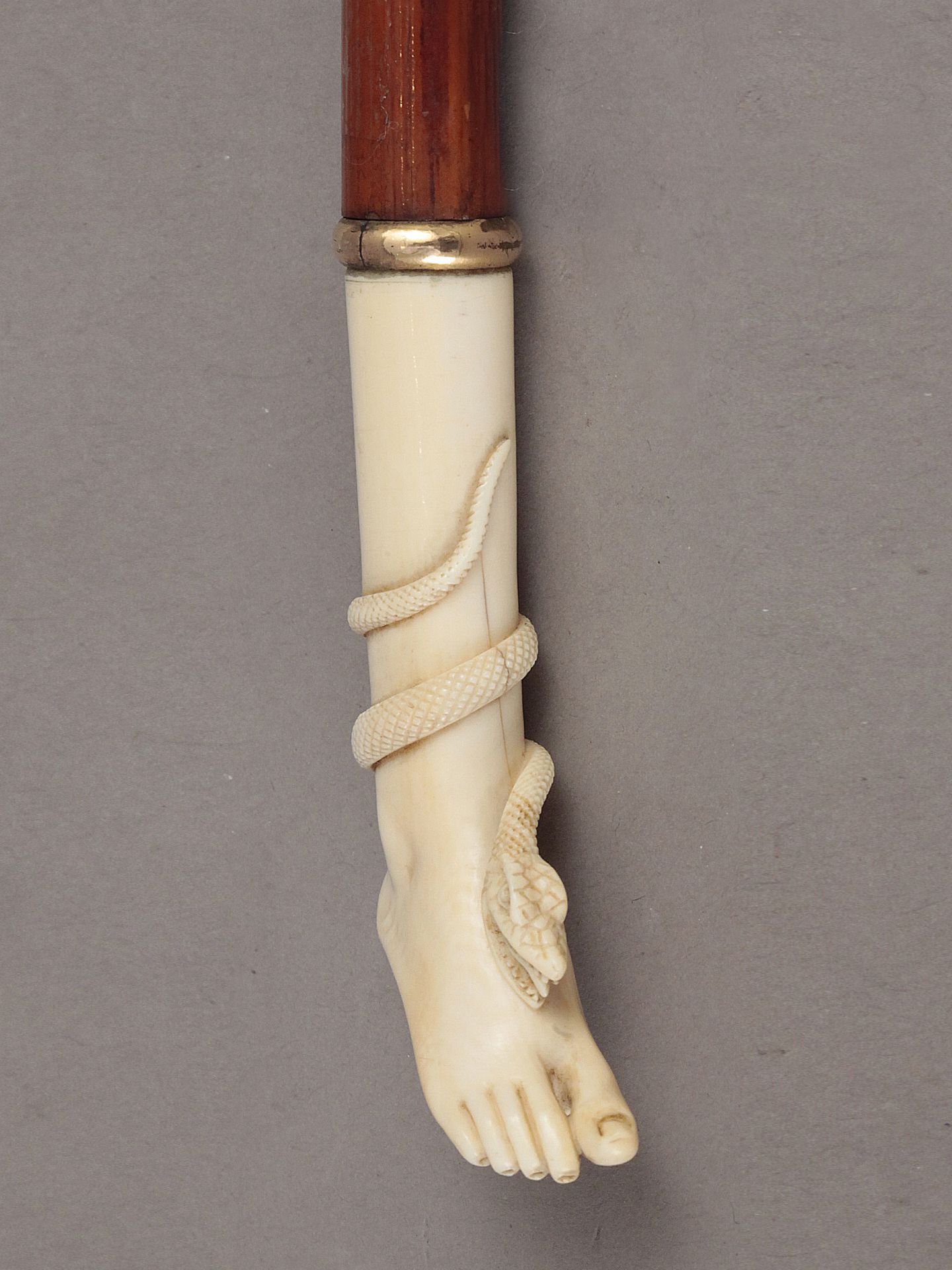 An early 20th century cherry tree wood and ivory walking cane