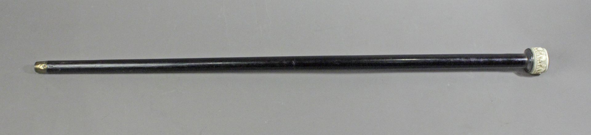 A 19th century ebony and ivory walking cane