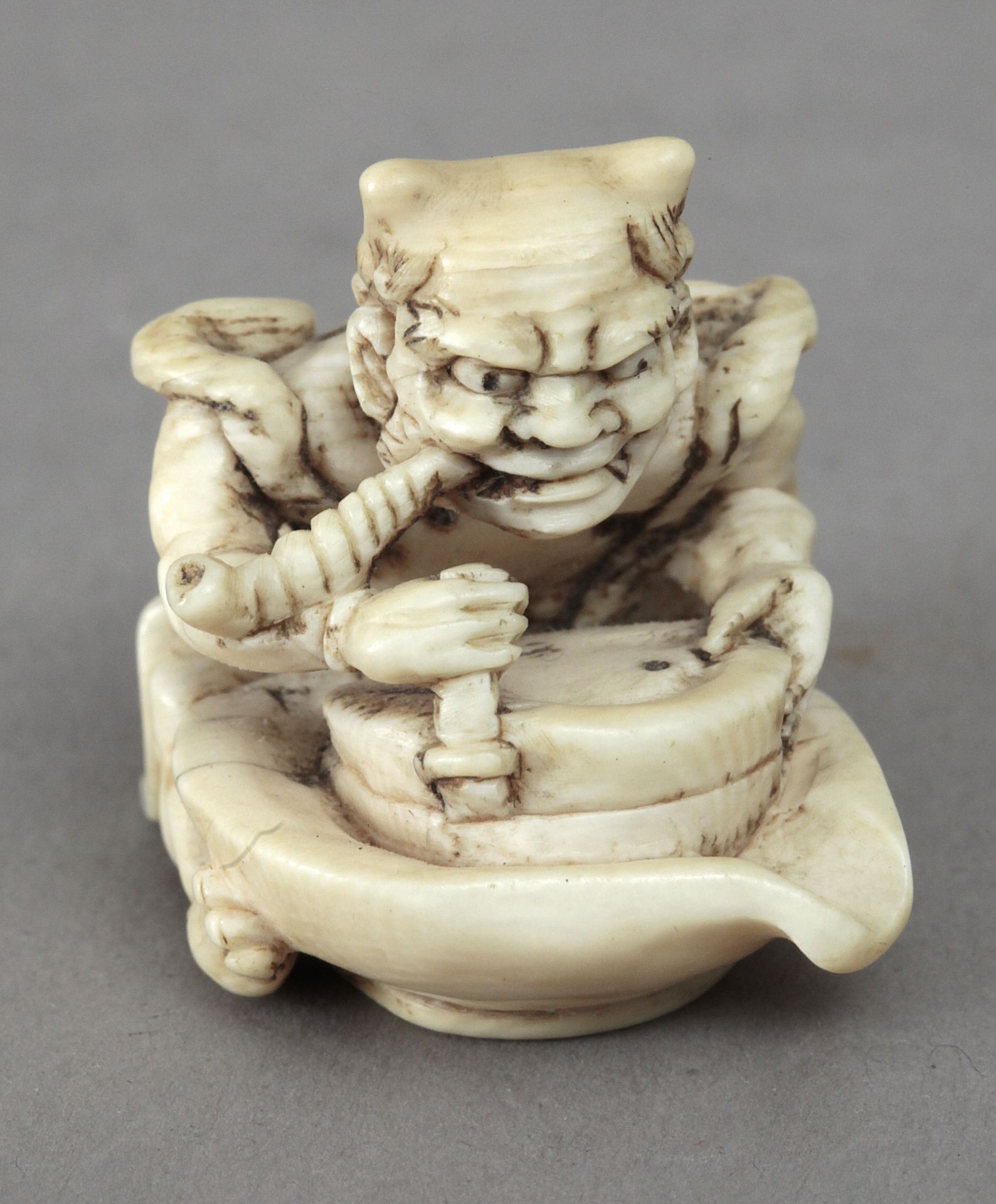 19th century Japanese school. A carved ivory netsuke depicting Oni