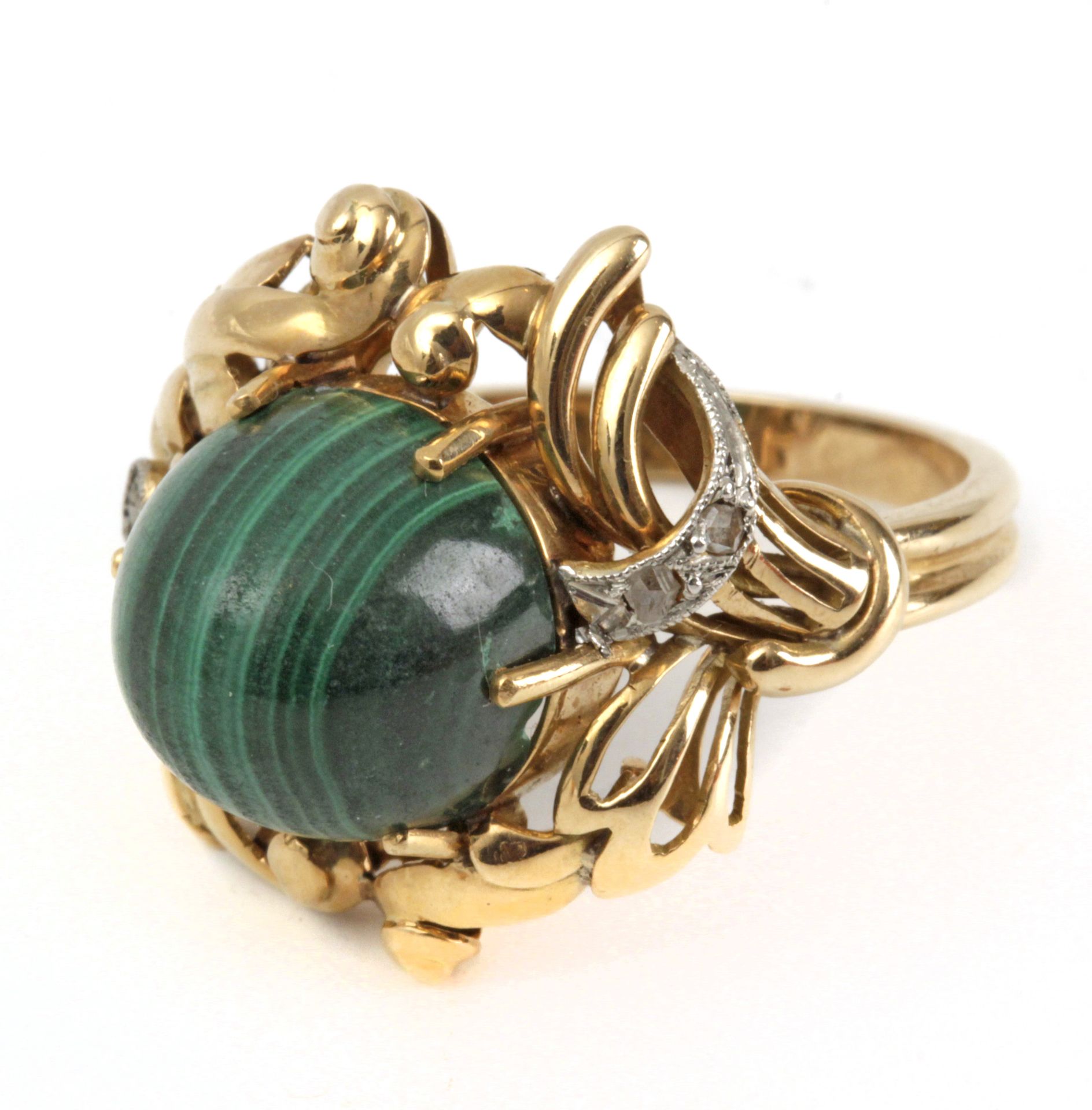 A ring circa 1950. Gold, rose cut diamonds and a malachite cabochon