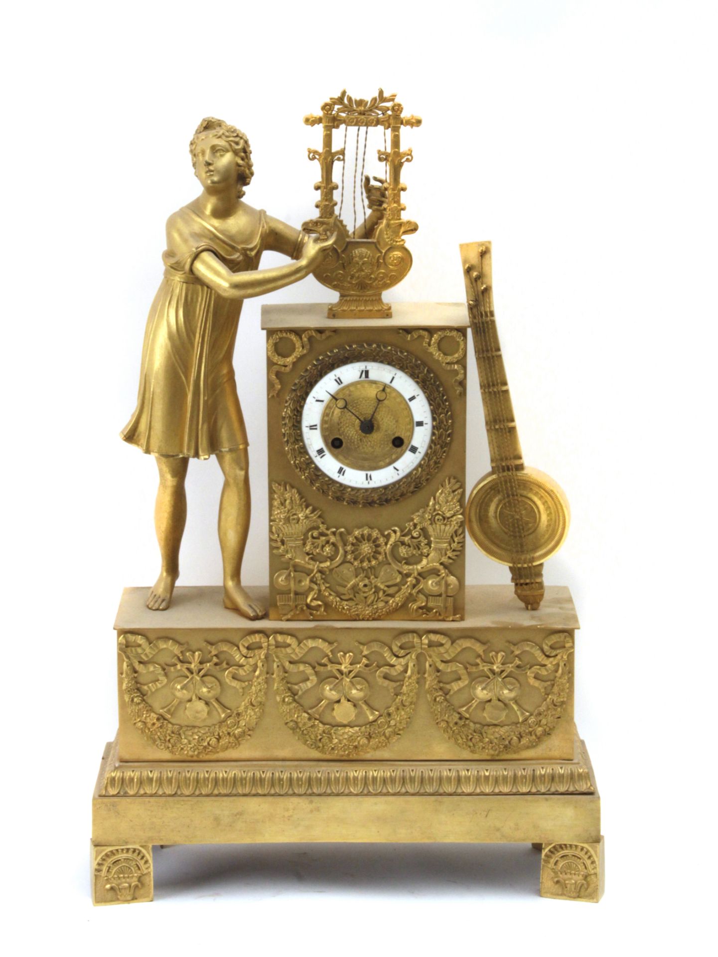 A 19th century French Empire period ormolu gilt bronze mantel clock