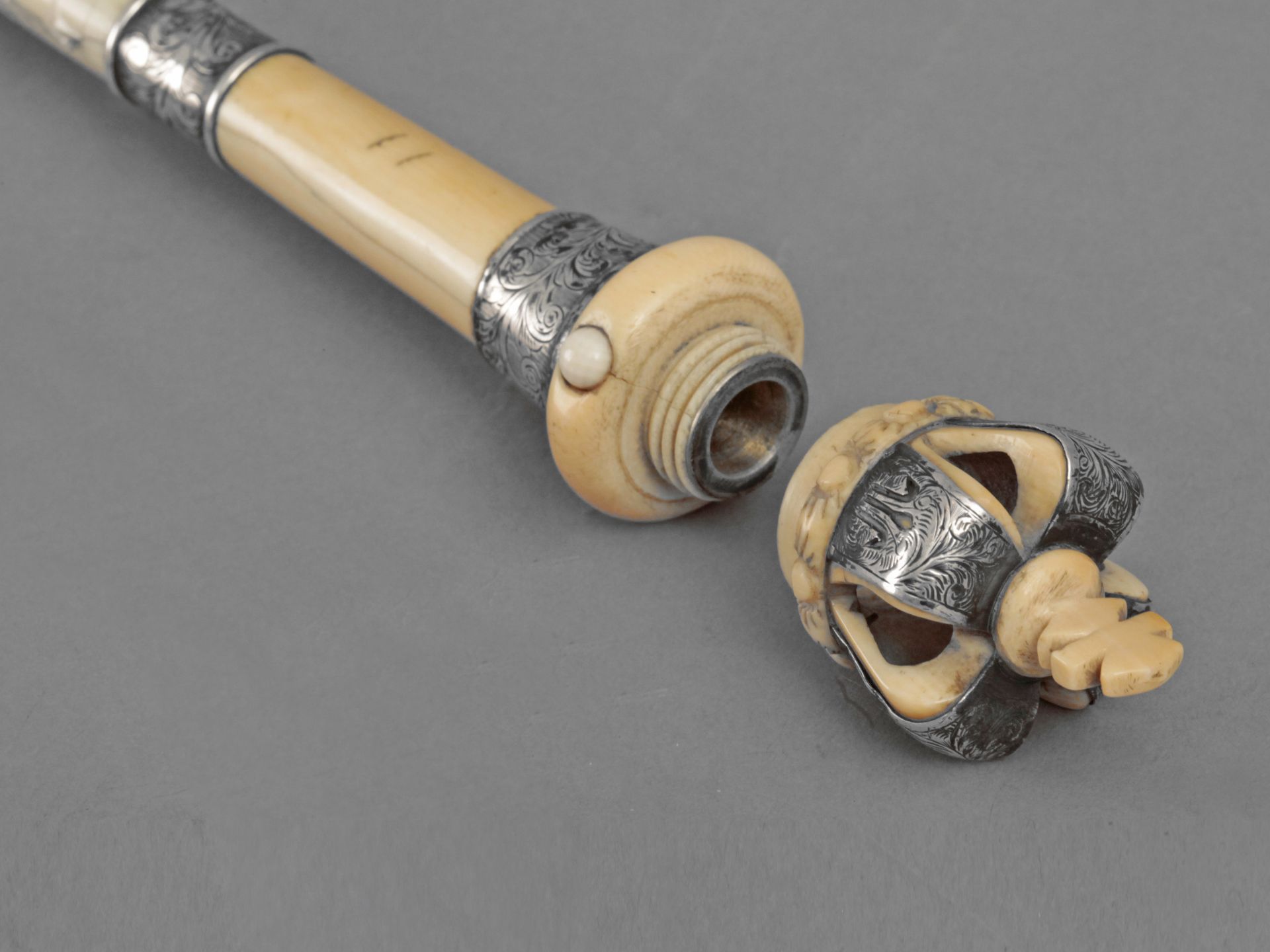 An English walking cane in carved ivory and silver circa 1887