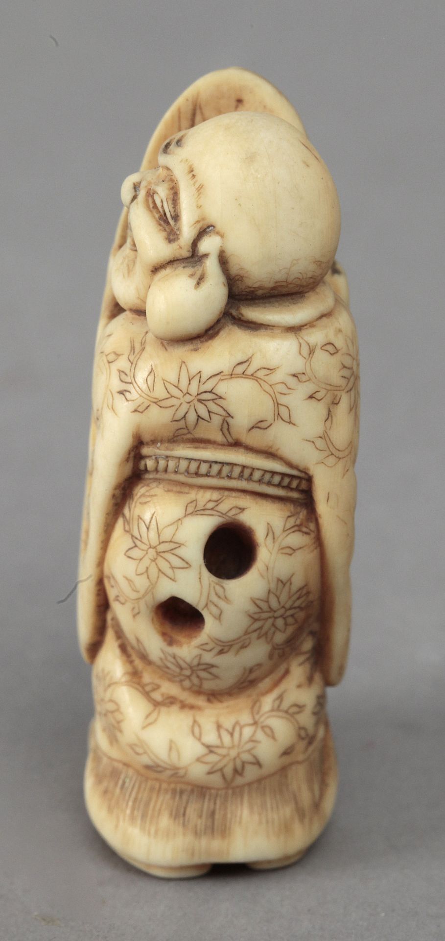 Early 19th century Japanese school. A carved ivory netsuke depicting a Hotei - Image 3 of 4