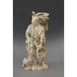 Late 19th century Japanese school. A carved ivory okimono depicting a farmer feeding birds. Signed