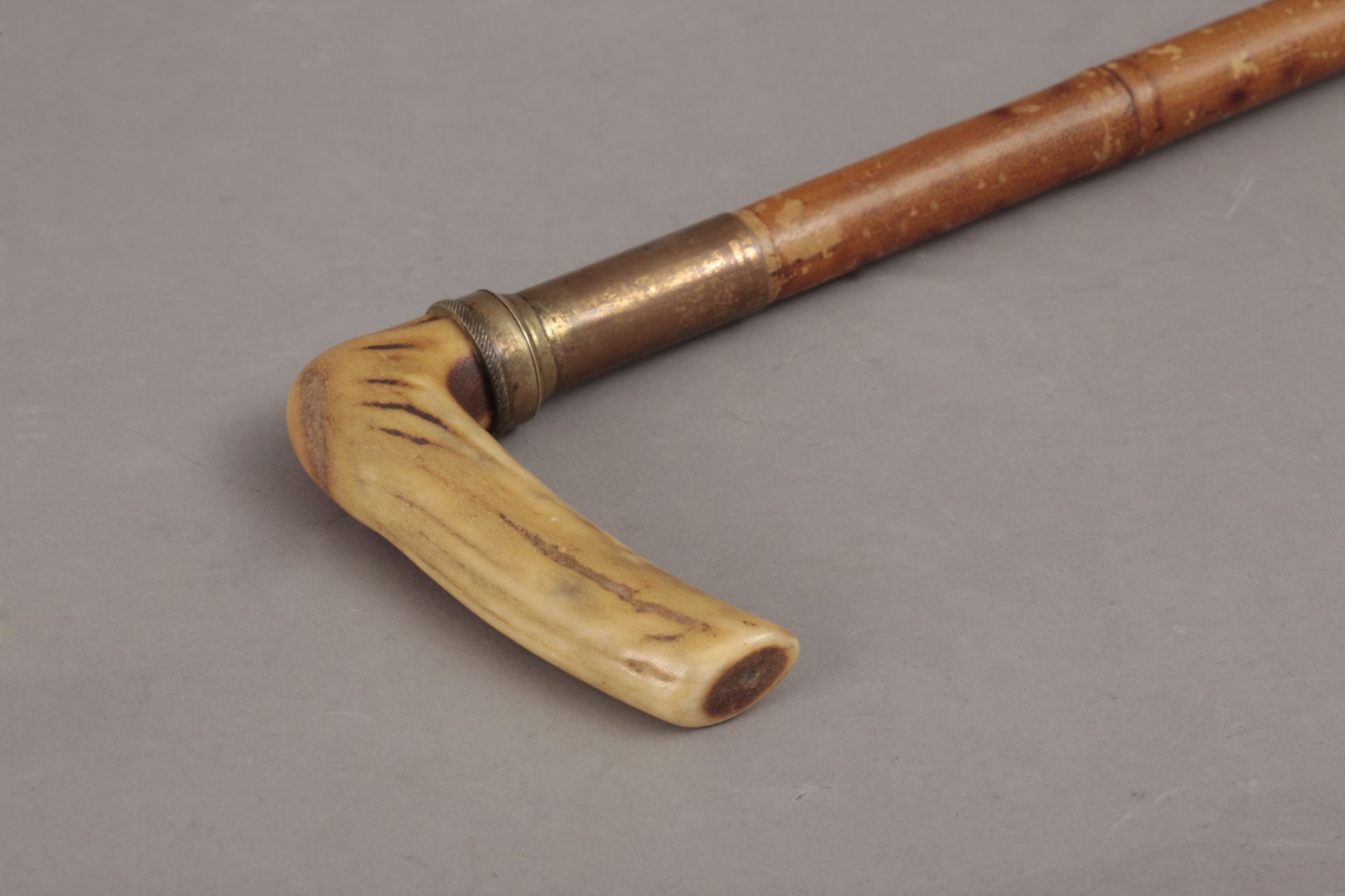 A 19th century bamboo and carved horn walking cane