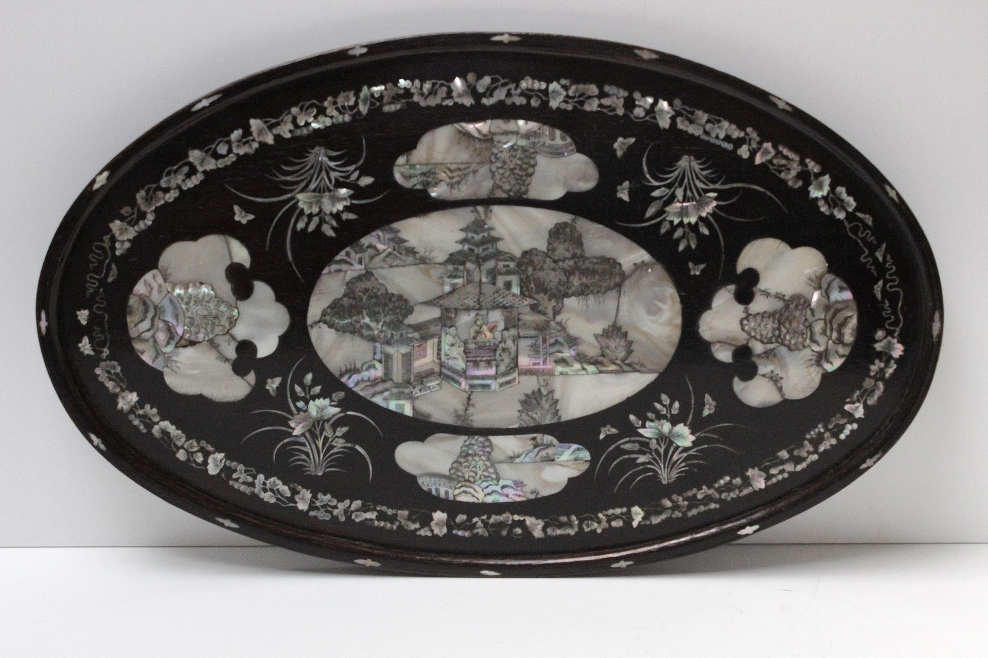 A Chinese serving tray circa 1900 in lacquered wood and mother of pearl inlays