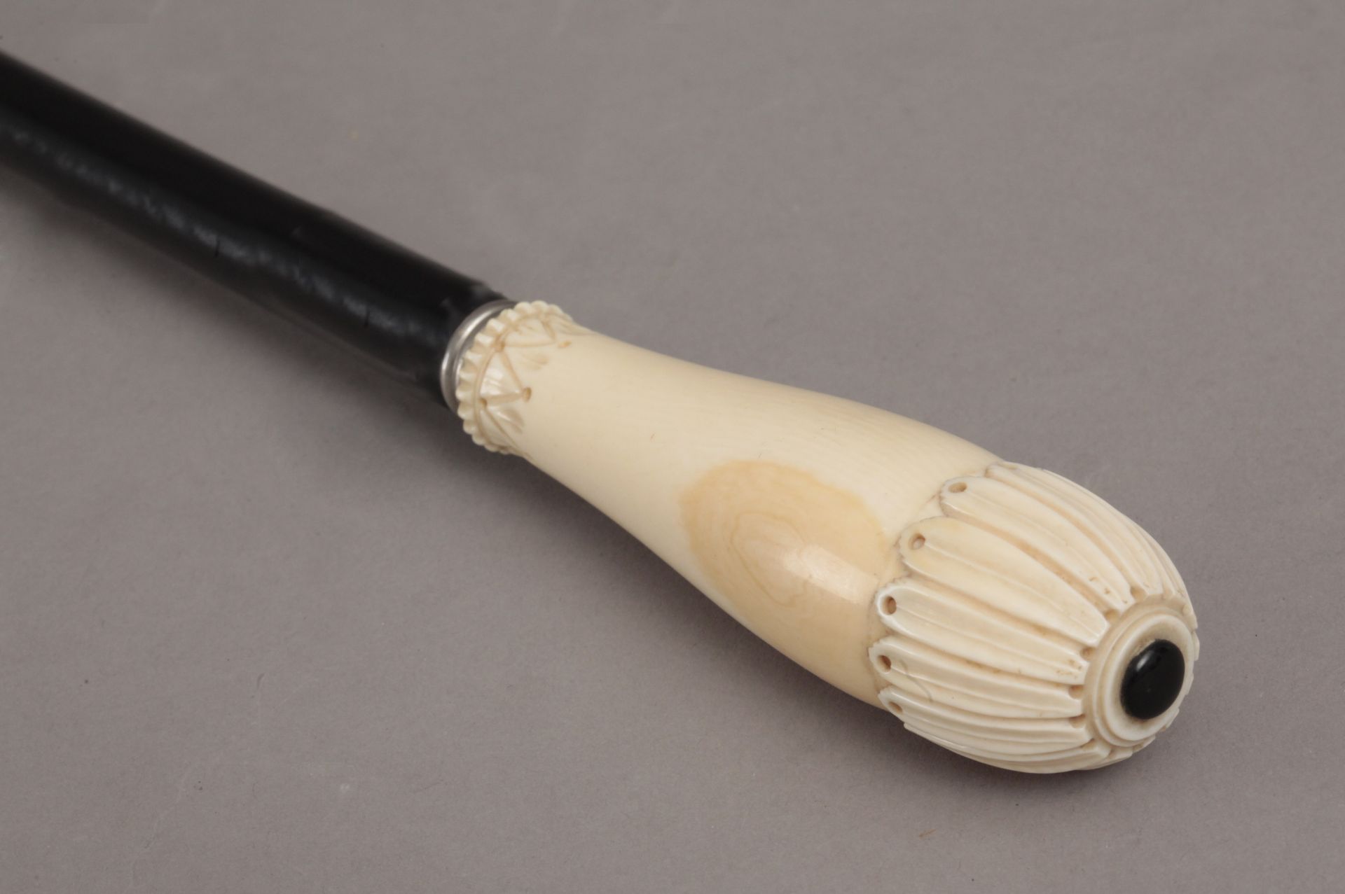 A 19th century ebony and ivory walking cane