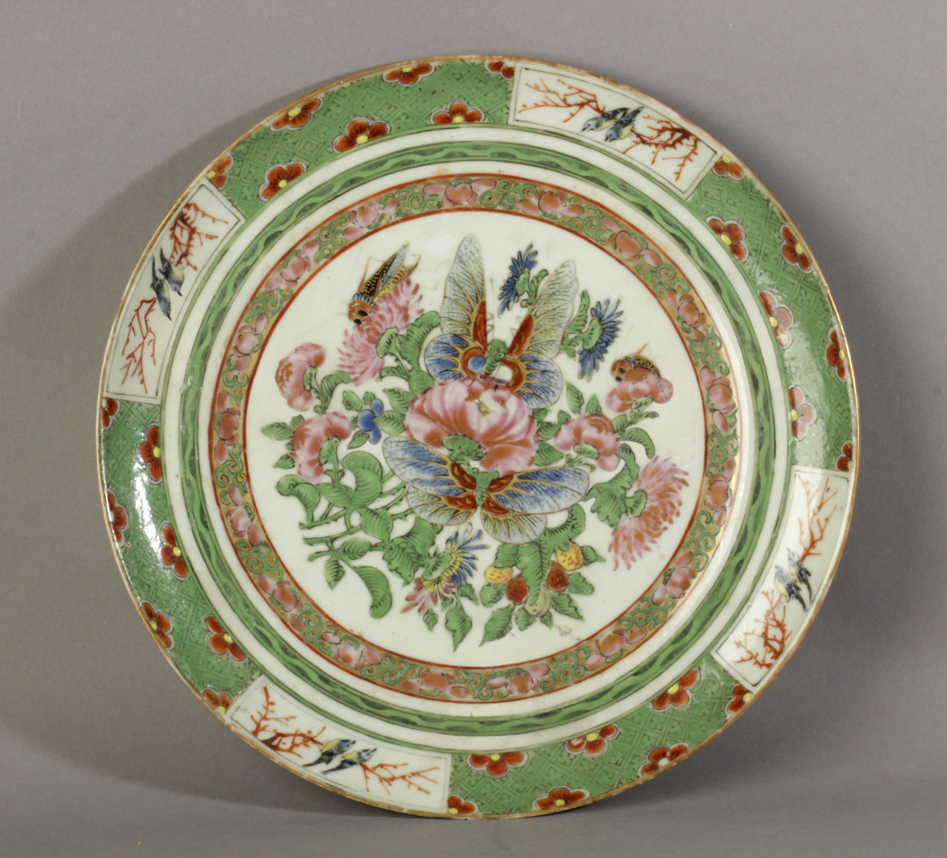 A 19th century Chinese Qing plate in Famille Rose porcelain