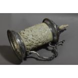 A late 19th century German tankard in silver and carved ivory depicting a battle scene