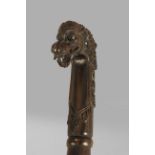 A 20th century Chinese walking cane in carved jacaranda or rosewood