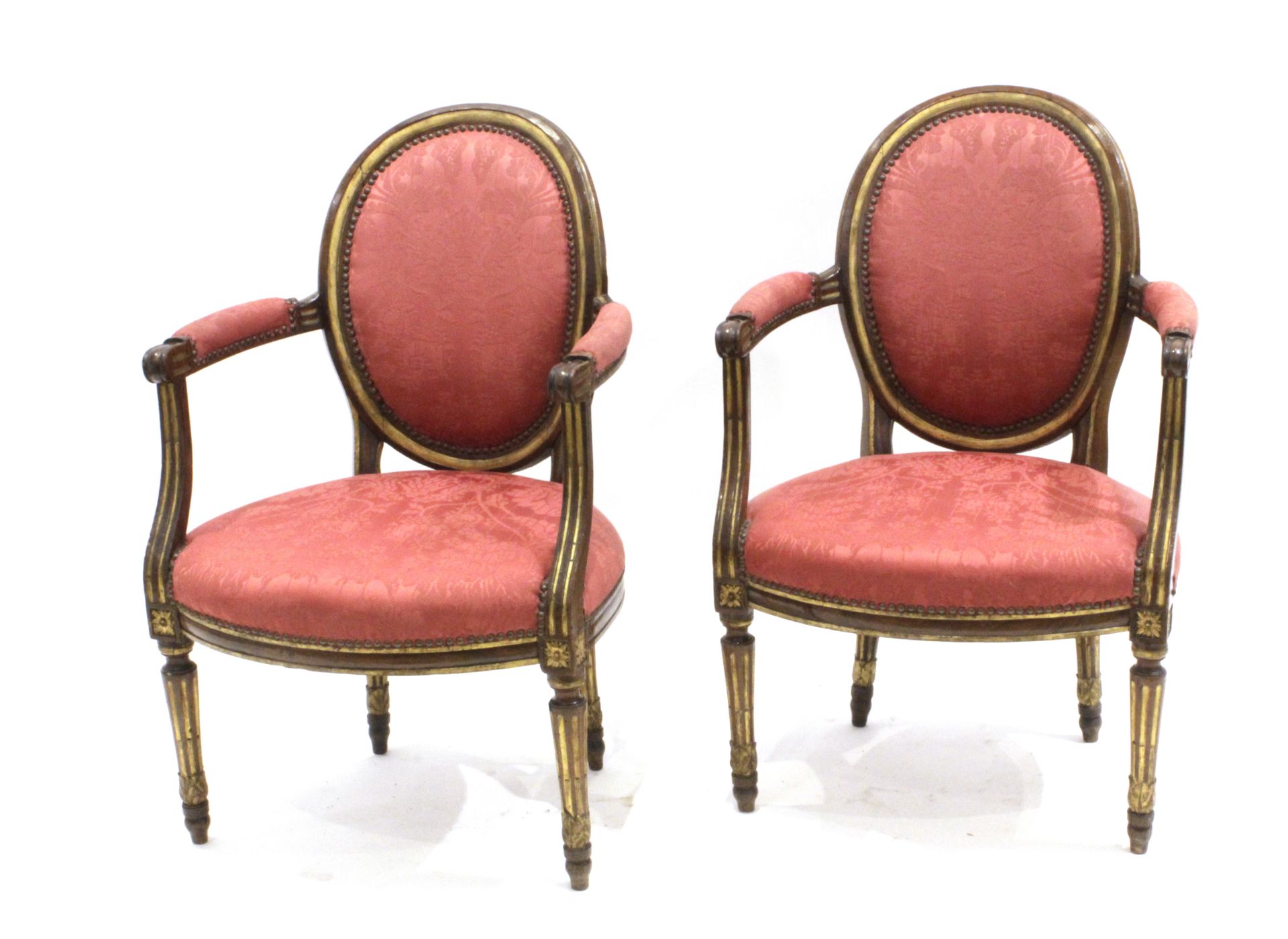 A pair of 20th century Louis XVI style armchairs