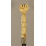 A 19th century possibly Indian walking cane in carved ebony and ivory