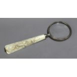 A 19th century magnifying glass in carved ivory and silver