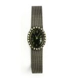 Universal Genève. Diamond and 18k. white gold ladies watch