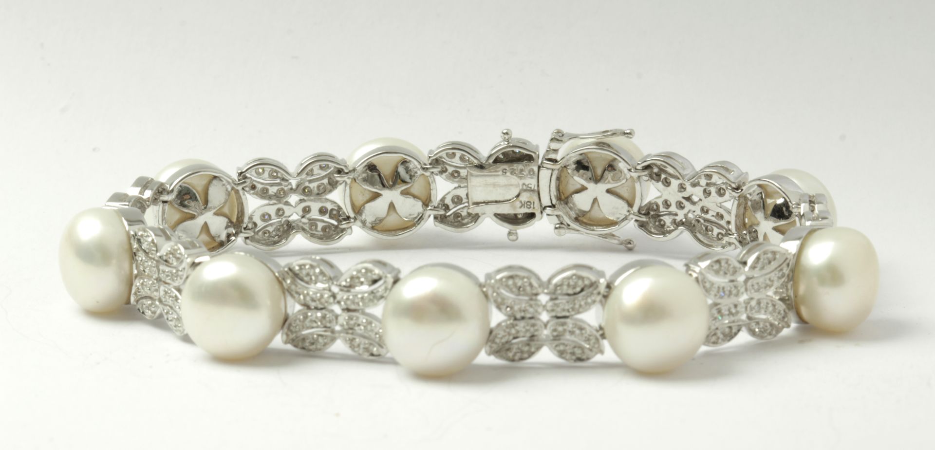 A freshwater pearls, diamonds and 18k. white gold bracelet