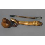 A kiseru or Japanese pipe from Meiji period (1868-1912). In carved bamboo and metal