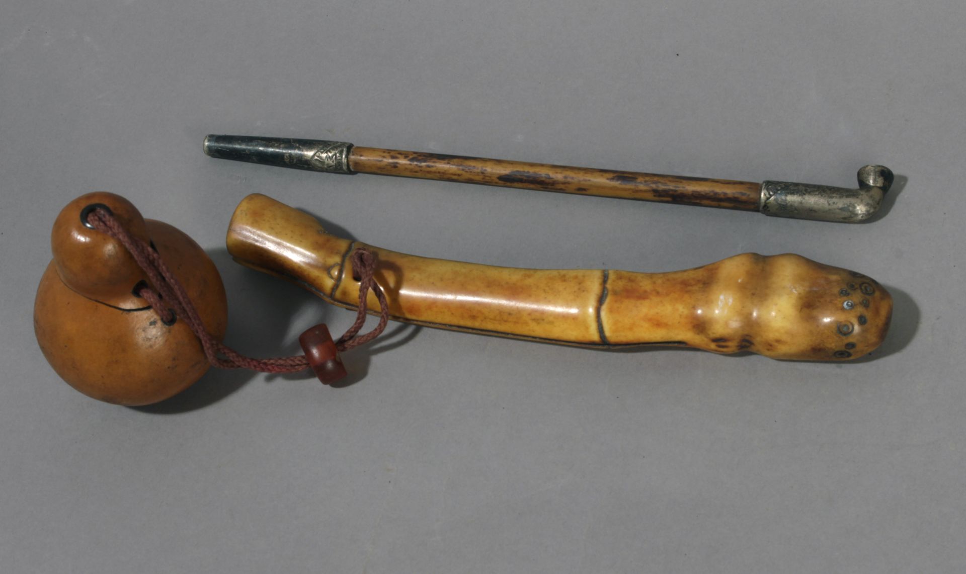A kiseru or Japanese pipe from Meiji period (1868-1912). In carved bamboo and metal