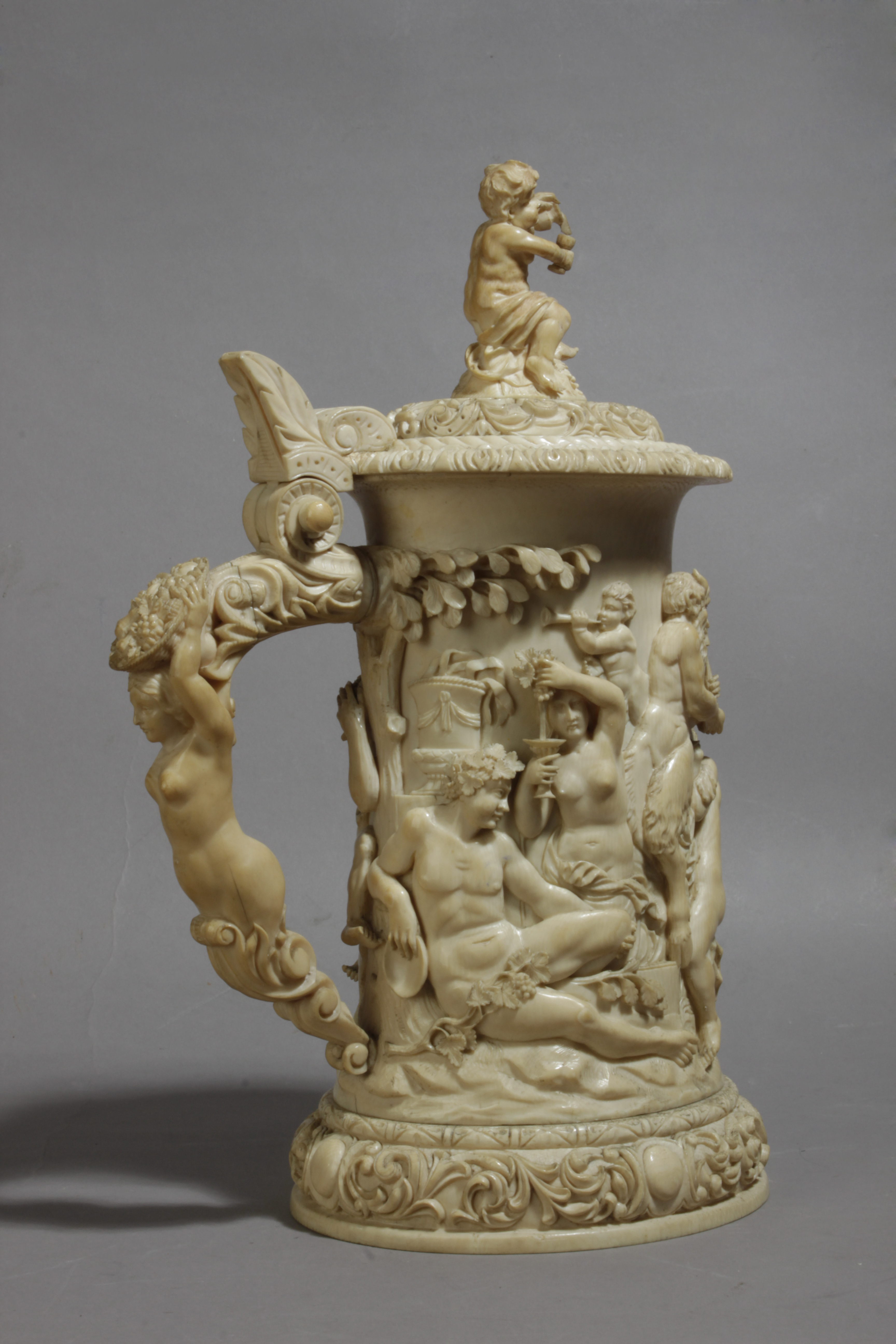 A 19th century German tankard in carved ivory depicting a Bacchanalia - Image 3 of 5