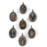 A collection of seven colonial reliquary pendants in mexican silver