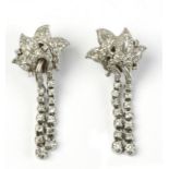 A pair of diamond and platinum long earrings circa 1960