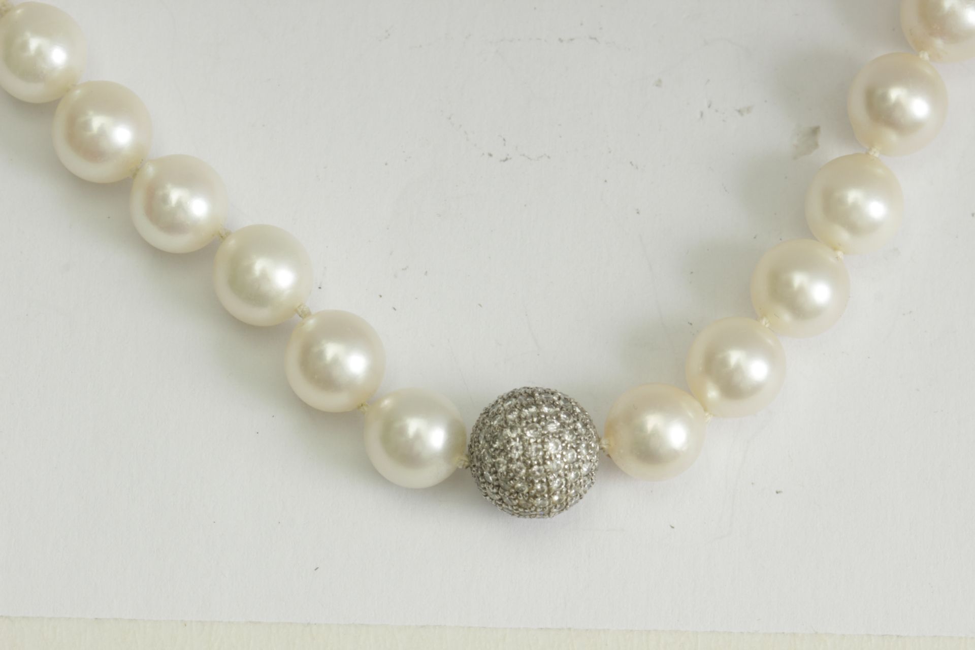 An Akoya cultured pearl necklace with a diamond and 18k. white gold details and clasp - Image 2 of 2