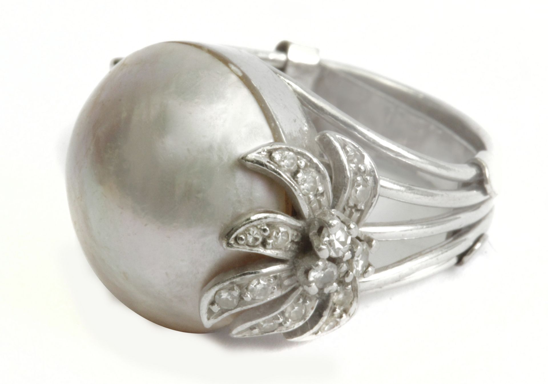 A mabe pearl and diamonds ring circa 1960 with a platinum setting