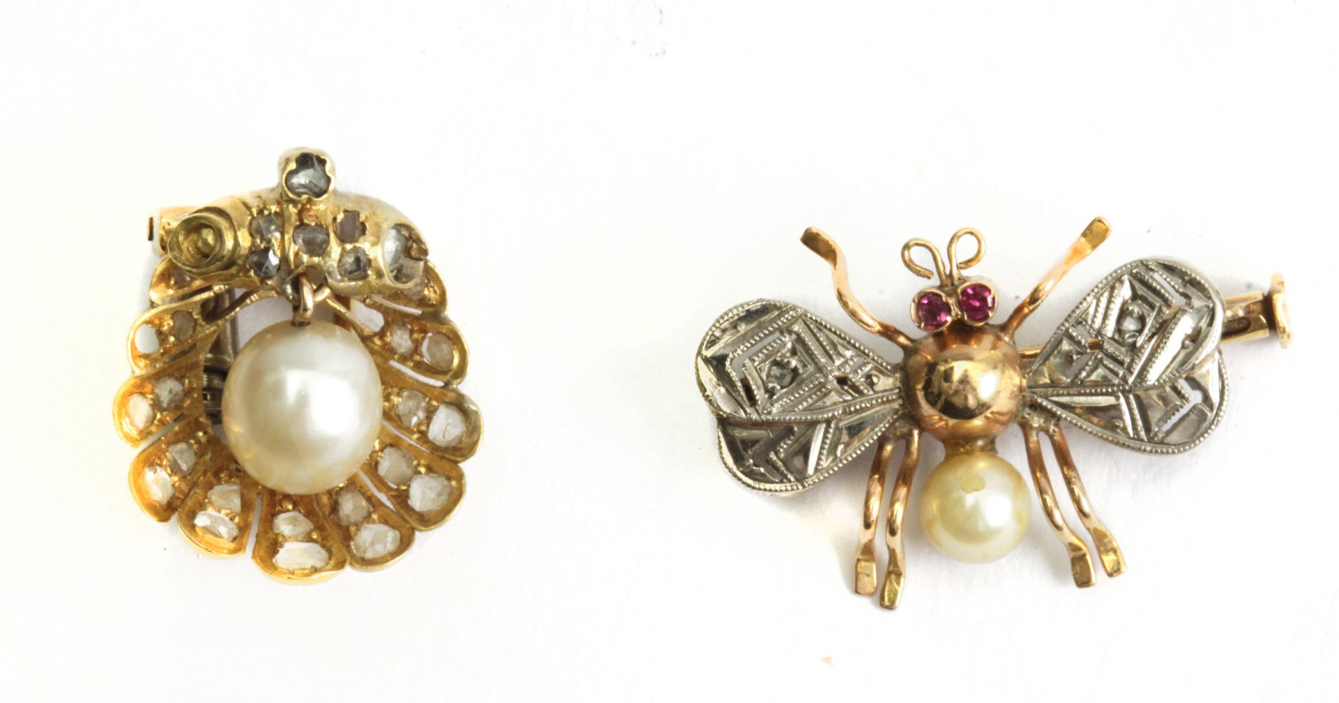 A first half of 20th century pearl and diamond tie pins